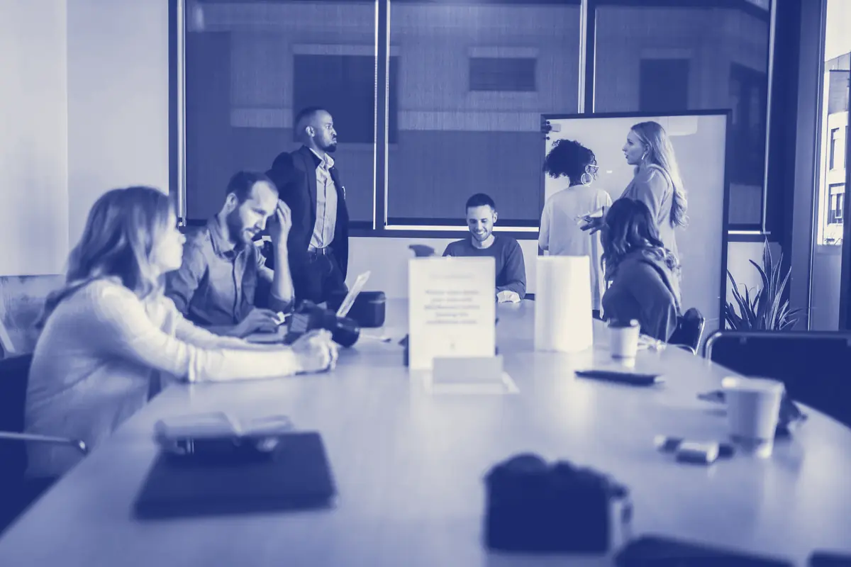 Finance team talking around a meeting table